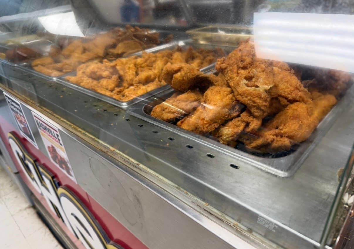 Chester's fried chicken displayed in the Big John's hot case